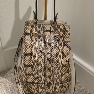 Gucci Ophidia bucket bag in python-embossed leather. 